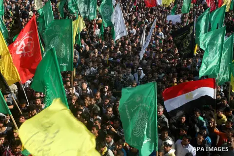 Palestinians gather to listen to Palestinian prime minister in the Gaza Strip Ismail Haniya delivering a speech in Gaza City on November 22, 2012. The ruling Hamas movement declared the day to be a public holiday to mark...