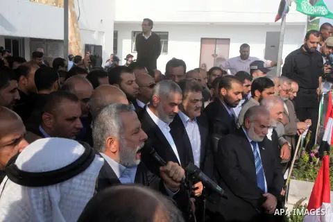 Palestinian prime minister in Gaza Ismail Haniyeh and Islamic Jihad leader Mohammed Al-Hindi, senior Fatah official Nabil Shaath and deputy speaker of Palestinian Parliament Ahmed Bahar celebrate what Palestinians say is...