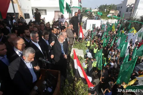 Palestinian prime minister in Gaza Ismail Haniyeh and Islamic Jihad leader Mohammed Al-Hindi, senior Fatah official Nabil Shaath and deputy speaker of Palestinian Parliament Ahmed Bahar celebrate what Palestinians say is...