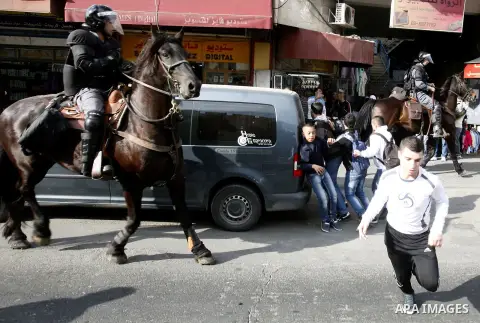 Israeli mounted police disperse Palestinian protestors who threw stones at a police station in Salahaddin street, a main commercial area of mostly Arab east Jerusalem, on November 22, 2012 . The incident followed the det...