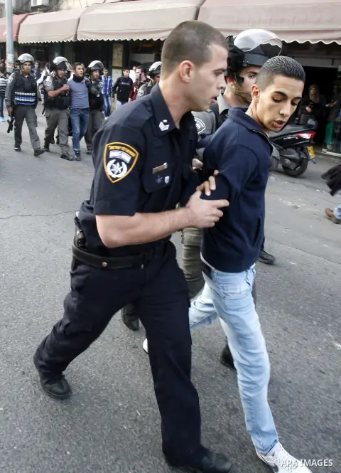 Israeli forces arrest a Palestinian youth on November 22, 2012 after Palestinians threw stones at a police station in Salahaddin street, a main commercial area of mostly Arab east Jerusalem. The incident followed the det...