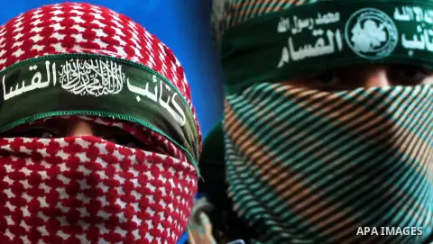 Abu Obaida , the spokesman for the Ezzedine Al-Qassam Brigades, the armed wing of Hamas, speaks during a news conference in Gaza City on November 22, 2012 at the house of their late leader Ahmed Jaabari, who was killed w...