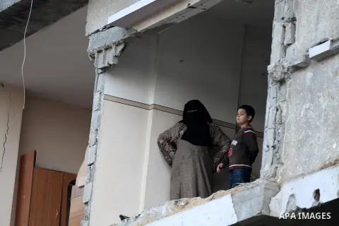 Palestinian Family members inspect thier house destroyed during a recent Israeli airstrike in Gaza City, 23 November 2012. Palestinians and Israelis on both sides of the Gaza border tried to resume everyday life after a...