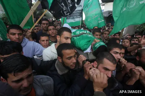 Palestinians carry the body of Anwar Qudih, 20, during his funeral in Khan Younis, southern Gaza Strip, Nov. 23, 2012. Israeli troops at the Gaza border shot dead Qudeh and wounded 15 more on Friday, health officials sai...