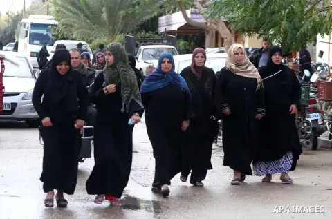 Palestinian women mourn during the funeral of Anwar Qudih, 20, in Khan Younis, southern Gaza Strip, Nov. 23, 2012. Israeli troops at the Gaza border shot dead Qudeh and wounded 15 more on Friday, health officials said, i...