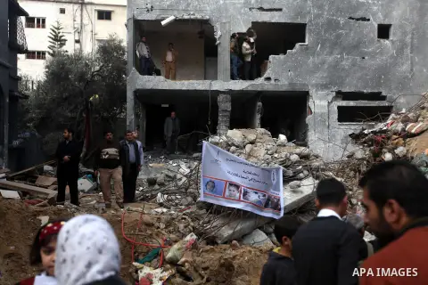Palestinians release balloons at the site of the destroyed house of the Dalou family in Gaza City November 24, 2012. Eleven members of the Dalou family were killed after an Israeli air strike on their house during the ei...