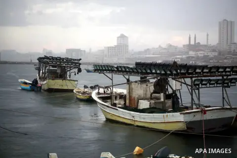 Palestinian fishermen prepare their boats in the port of Gaza on the Mediterranean coast in Gaza City on November 24, 2012, as a fragile truce between Israel and militant groups in Gaza enters its third day. Israel slamm...