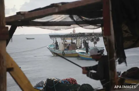 Palestinian fishermen prepare their boats in the port of Gaza on the Mediterranean coast in Gaza City on November 24, 2012, as a fragile truce between Israel and militant groups in Gaza enters its third day. Israel slamm...