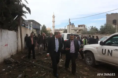 Robert H. Serry, the United Nations special coordinator for the Middle East Peace Process, talks with a wounded Palestinian man during his visit to Gaza Strip in Gaza City on Nov. 25, 2012. Photo by Ashraf Amra