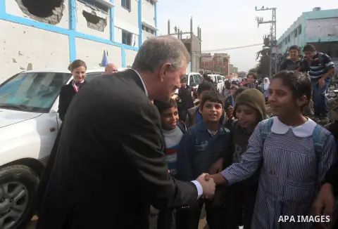 Robert H. Serry, the United Nations special coordinator for the Middle East Peace Process, talks with a wounded Palestinian man during his visit to Gaza Strip in Gaza City on Nov. 25, 2012. Photo by Ashraf Amra