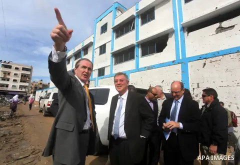 Robert H. Serry, the United Nations special coordinator for the Middle East Peace Process, talks with a wounded Palestinian man during his visit to Gaza Strip in Gaza City on Nov. 25, 2012. Photo by Ashraf Amra