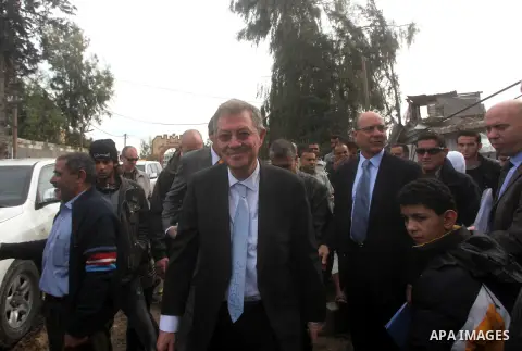 Robert H. Serry, the United Nations special coordinator for the Middle East Peace Process, talks with a wounded Palestinian man during his visit to Gaza Strip in Gaza City on Nov. 25, 2012. Photo by Ashraf Amra