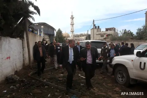Robert H. Serry, the United Nations special coordinator for the Middle East Peace Process, talks with a wounded Palestinian man during his visit to Gaza Strip in Gaza City on Nov. 25, 2012. Photo by Ashraf Amra