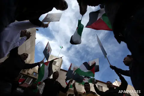 Palestinians hold posters of Palestinian President Mahmoud Abbas during a rally supporting the Palestinian UN bid for observer state status, in the West Bank city of Ramallah, Sunday, Nov. 25, 2012. The Palestinians will...