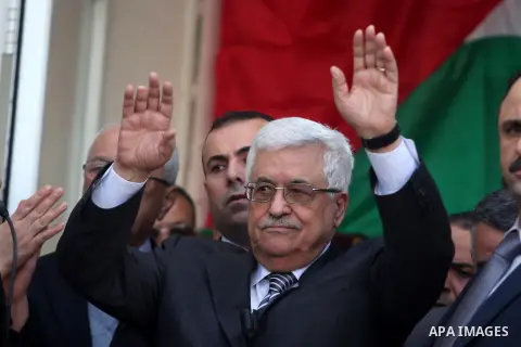 Palestinian President Mahmoud Abbas gestures as he speaks during a rally supporting the Palestinian UN bid for observer state status, in the West Bank city of Ramallah, Sunday, Nov. 25, 2012. The Palestinians will reques...