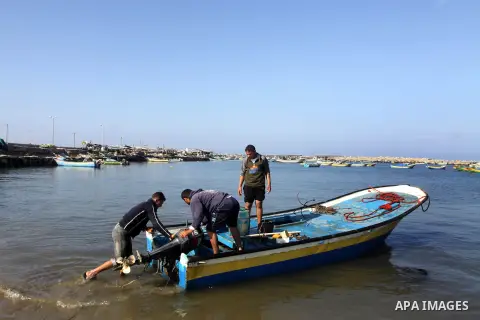 Palestinian fishermen prepare their boats in the port of Gaza on the Mediterranean coast, on Nov. 26, 2012, as a fragile truce between Israel and militant groups in Gaza enters its third day. Israel slammed Palestinian p...