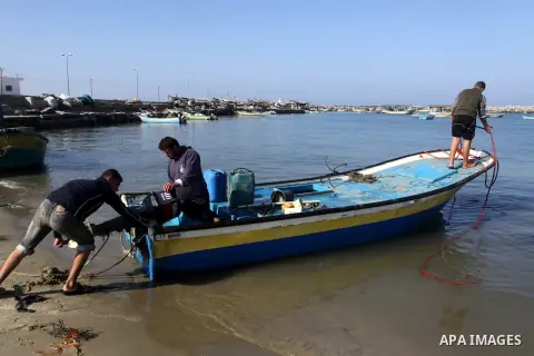 Palestinian fishermen prepare their boats in the port of Gaza on the Mediterranean coast, on Nov. 26, 2012, as a fragile truce between Israel and militant groups in Gaza enters its third day. Israel slammed Palestinian p...