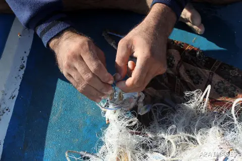 Palestinian fishermen prepare their boats in the port of Gaza on the Mediterranean coast, on Nov. 26, 2012, as a fragile truce between Israel and militant groups in Gaza enters its third day. Israel slammed Palestinian p...