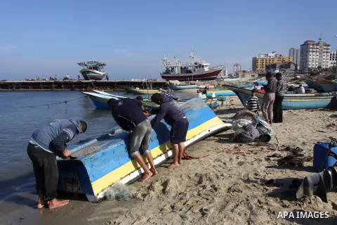 Palestinian fishermen prepare their boats in the port of Gaza on the Mediterranean coast, on Nov. 26, 2012, as a fragile truce between Israel and militant groups in Gaza enters its third day. Israel slammed Palestinian p...