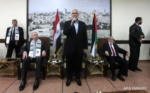 Palestinian Prime Minister in Gaza strip Ismail Haniyeh speaks during the visit of Iraqi Parliament delegation, in Gaza city, November 26, 2012. The Iraqi Parliament Speaker Osama Najafi visits Gaza with the delegation i...