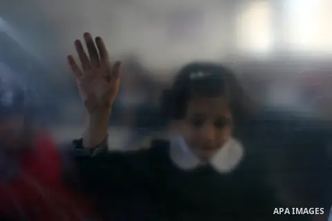 A Palestinian school girl stands at her classroom in a damaged school in Rafah southern Gaza strip on November 26, 2012. The school was damaged some days ago, before a truce between Hamas and Israel ended eight days of c...