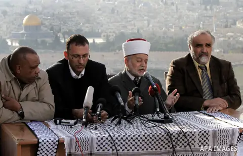 Sheikh Mohammed Hussein (second right) the Grand Mufti of Jerusalem speaks during a press conference to support the Palestinian UN bid for observer state status, in Jerusalem, Nov. 26, 2012. The Palestinians will request...