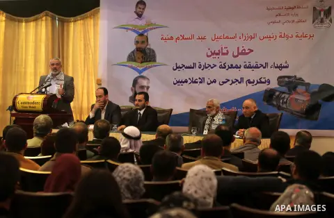 Palestinian Prime Minister in Gaza strip Ismail Haniyeh speaks during a ceremony to honor the wounded journalists in Gaza city on November 26, 2012. Israeli aircraft killed 3 and wounded more than 17 journalists in the I...