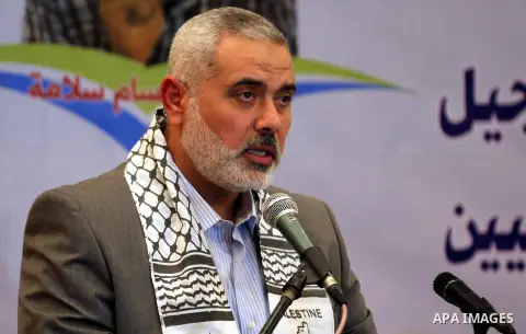 Palestinian Prime Minister in Gaza strip Ismail Haniyeh speaks during a ceremony to honor the wounded journalists in Gaza city on November 26, 2012. Israeli aircraft killed 3 and wounded more than 17 journalists in the I...