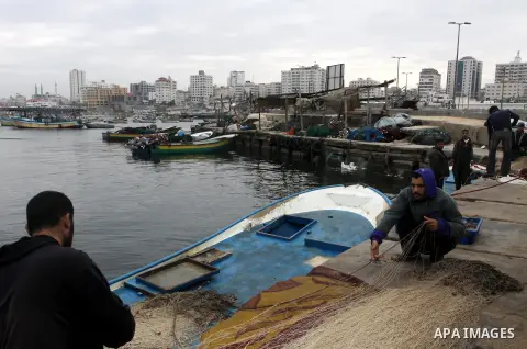 Palestinian fishermen prepare their boats in the port of Gaza on the Mediterranean coast, on November 27, 2012. Israel eased restrictions on Gaza fishermen on Saturday, further implementing truce brokered by Egypt after...