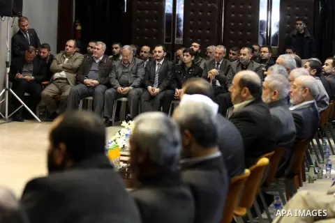 Palestinians listen to the speech of Prime Minister in Gaza strip Ismail Haniyeh during a ceremony to honor the families of martyrs in Gaza city on November 27, 2012. Israeli aircraft killed 166 including scores of civil...