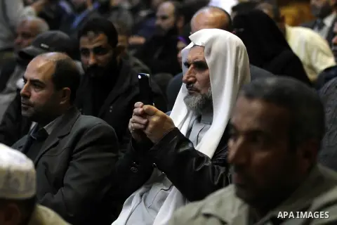 Palestinians listen to the speech of Prime Minister in Gaza strip Ismail Haniyeh during a ceremony to honor the families of martyrs in Gaza city on November 27, 2012. Israeli aircraft killed 166 including scores of civil...