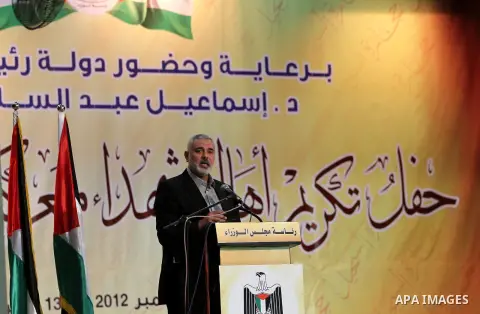 Palestinian Prime Minister in Gaza strip Ismail Haniyeh speaks during a ceremony to honor the families of martyrs in Gaza city on November 27, 2012. Israeli aircraft killed 166 including scores of civilians , and injured...