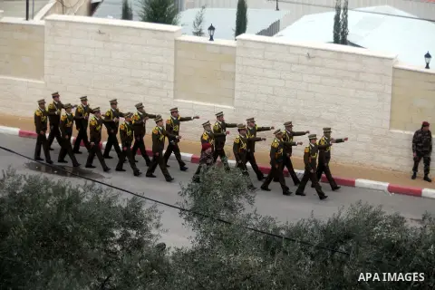 Members of a Palestinian honour guard leave after a wreath laying ceremony near the grave of the late leader Yasser Arafat, in the West Bank city of Ramallah, November 27, 2012. Forensic experts took samples from Arafat'...