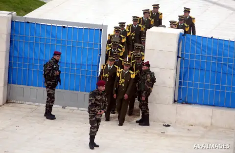 Members of a Palestinian honour guard leave after a wreath laying ceremony near the grave of the late leader Yasser Arafat, in the West Bank city of Ramallah, November 27, 2012. Forensic experts took samples from Arafat'...