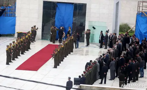 Tayeb Abdel Rahim (front), secretary-general of the Palestinian presidency, places a wreath at the tomb of late Palestinian leader during a ceremony in the West Bank city of Ramallah, on Nov. 27, 2012. Samples of the rem...