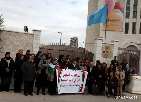 Palestinian women gather in front of U.N. headquarter during a rally to support of requesting membership in the United Nations, in the West Bank city of Ramallah on November 27, 2012. The Palestinians will request to upg...