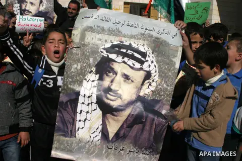 Palestinians student hold posters of Palestinian President Mahmoud Abbas during a rally supporting the Palestinian UN bid for observer state status, in the West Bank city of Hebron, Nov. 28, 2012. The Palestinians will r...