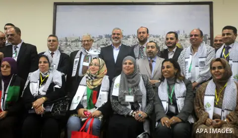 Palestinian Prime Minister in Gaza strip Ismail Haniyeh with the delegation of the General Union of Arab journalists pose to camera in Gaza city on November 28, 2012. Israeli aircraft killed 3 and wounded more than 17 jo...
