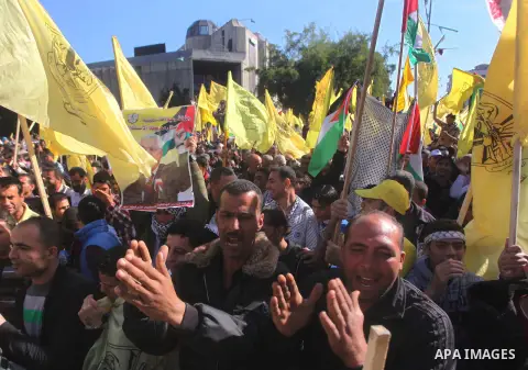 Palestinians take part in a rally in support of the efforts of President Mahmoud Abbas (pictured in poster) to secure a diplomatic upgrade at the United Nations, in Gaza City November 29, 2012. The U.N. General Assembly...