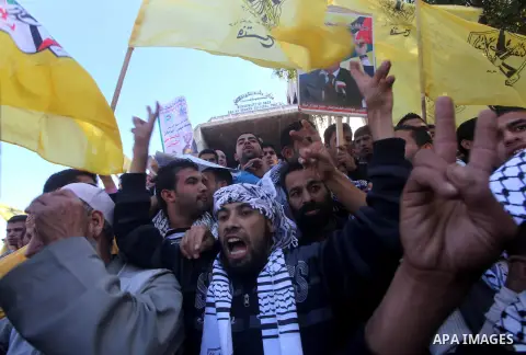 Palestinians take part in a rally in support of the efforts of President Mahmoud Abbas (pictured in poster) to secure a diplomatic upgrade at the United Nations, in Gaza City November 29, 2012. The U.N. General Assembly...