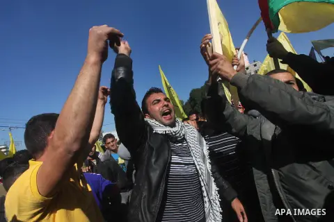 Palestinians take part in a rally in support of the efforts of President Mahmoud Abbas (pictured in poster) to secure a diplomatic upgrade at the United Nations, in Gaza City November 29, 2012. The U.N. General Assembly...