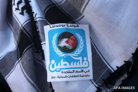 Palestinians take part in a rally in support of the efforts of President Mahmoud Abbas (pictured in poster) to secure a diplomatic upgrade at the United Nations, in Gaza City November 29, 2012. The U.N. General Assembly...