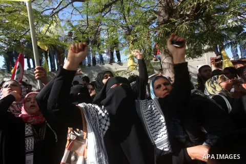 Palestinians take part in a rally in support of the efforts of President Mahmoud Abbas (pictured in poster) to secure a diplomatic upgrade at the United Nations, in Gaza City November 29, 2012. The U.N. General Assembly...