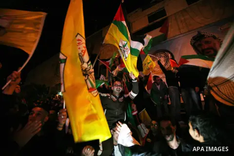 Palestinians celebrate in the West Bank city of Hebron on November 29, 2012 after the General Assembly voted to recognise Palestine as a non-member state. The UN General Assembly on Thursday voted overwhelmingly to recog...