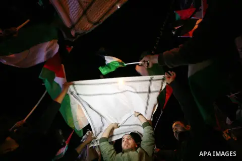 Palestinians celebrate in the West Bank city of Hebron on November 29, 2012 after the General Assembly voted to recognise Palestine as a non-member state. The UN General Assembly on Thursday voted overwhelmingly to recog...