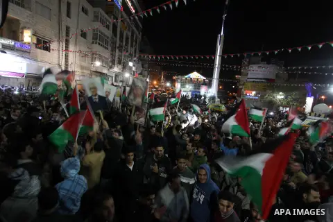 Palestinians celebrate in the West Bank city of Hebron on November 29, 2012 after the General Assembly voted to recognise Palestine as a non-member state. The UN General Assembly on Thursday voted overwhelmingly to recog...