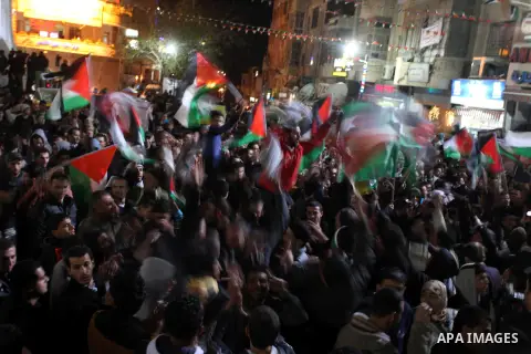 Palestinians celebrate in the West Bank city of Hebron on November 29, 2012 after the General Assembly voted to recognise Palestine as a non-member state. The UN General Assembly on Thursday voted overwhelmingly to recog...