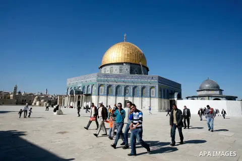 Palestinians walk at the al-Aqsa mosque compound following the Friday prayer in Jerusalem's old city on November 30, 2012. Photo by Mahfouz Abu Turk