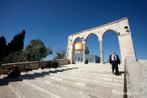 Palestinians walk at the al-Aqsa mosque compound following the Friday prayer in Jerusalem's old city on November 30, 2012. Photo by Mahfouz Abu Turk