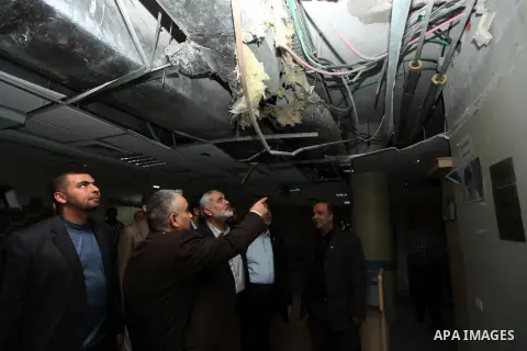 Palestinian Prime Minister in Gaza strip Ismail Haniyeh inspects the damage in the Jordanian Hospital in Gaza city, November 30, 2012. Israeli aircraft targeted the Jordanian hospital during an eight-day cross-border vio...